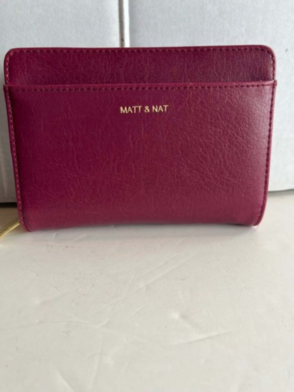 Matt and Nat zip-around accordion wallet.